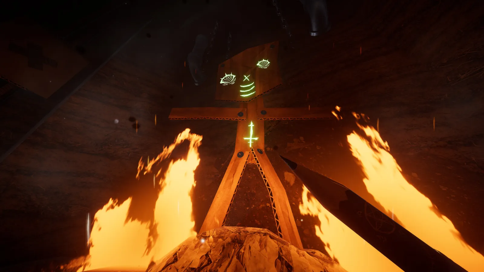 Steam screenshot of flame-lit cardboard cross figure in green light